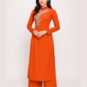 (@natalienguye52) Orange Ao Dai Set of Pants And Top with Silver Floral Detail